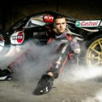 PBartek-Ostalowski-poses-for-a-photo-next-to-his-racing-car