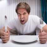 bigstock-Angry-Man-Holding-Knife-And-Fotiny-800x533